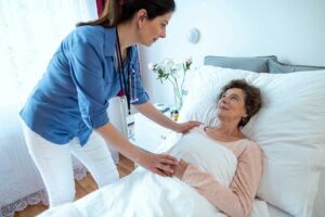 Care coordinator reviews a resident’s medication list and appointment calendar at an assisted living table.